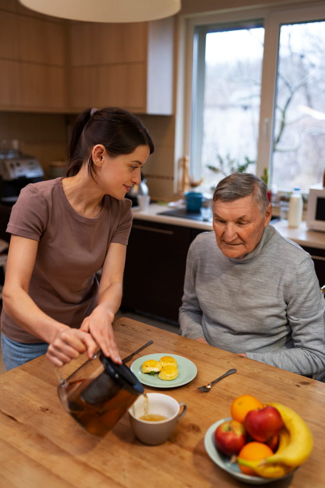 Caregiver helping elderly person at home